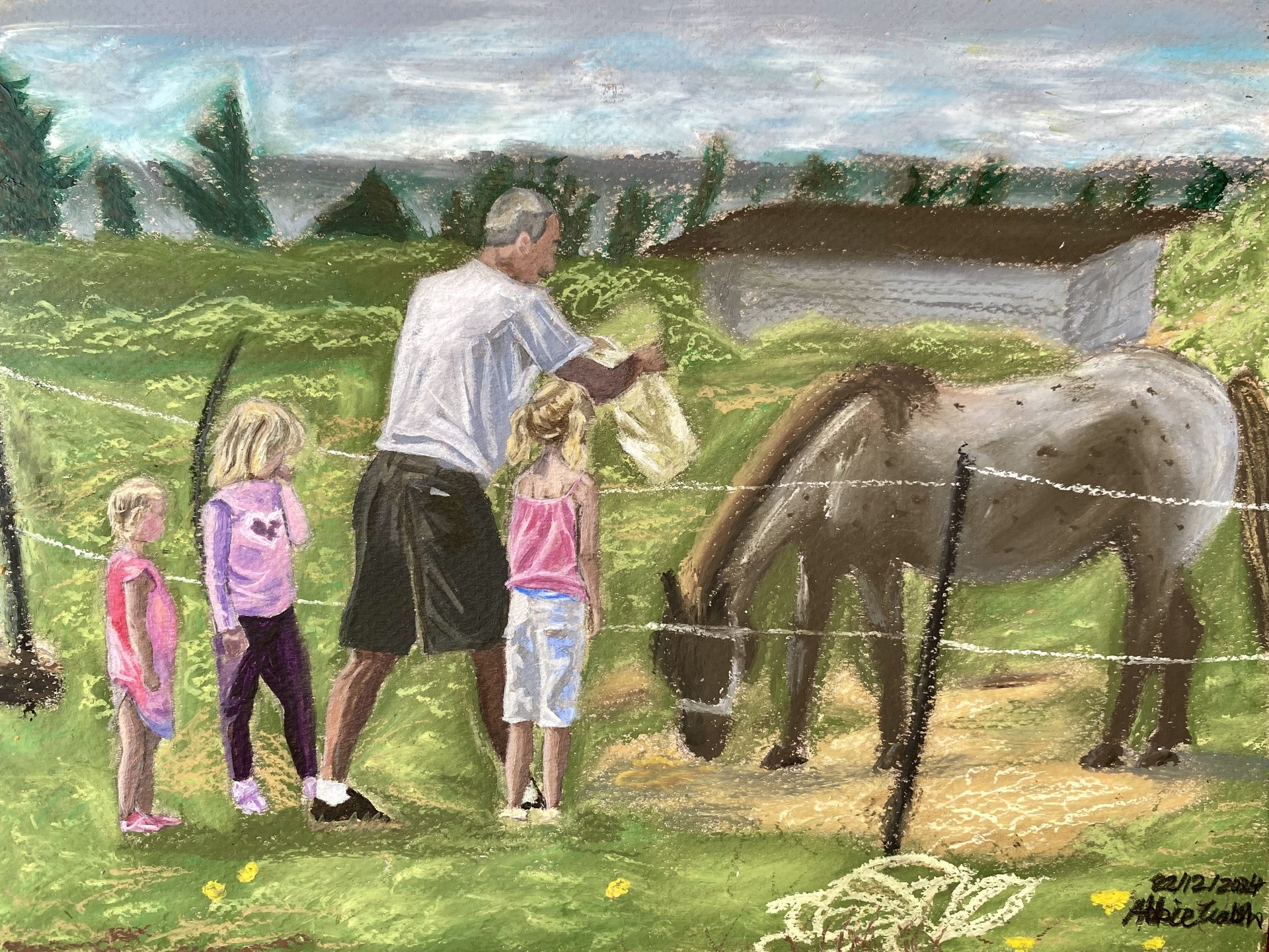 A man and three young children look at a horse, grazing in a fenced in field. 
